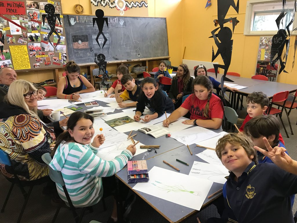 Young people participating in a bush tucker and medicine workshop on Jaara Country  with Aunty Julie McHale at The Meeting Place.