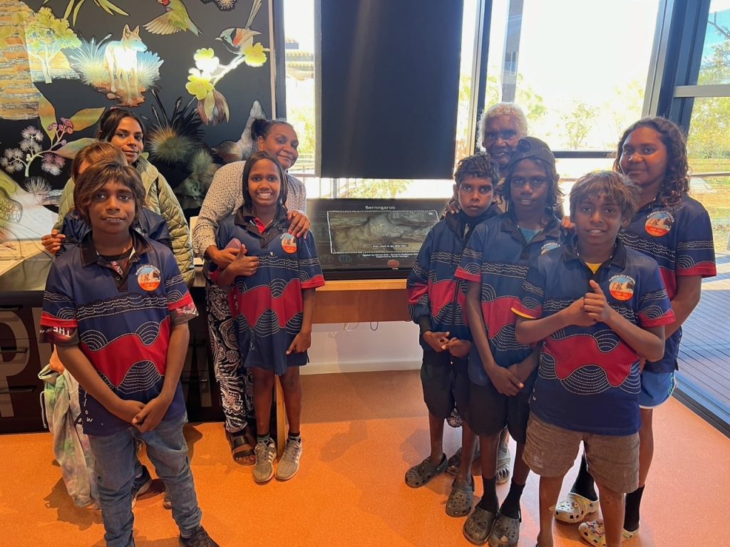 Sophia Mung & Shirley Drill & Purnululu School students with the Jirraginy joo Goorrarndal - Frog and Brolga Interactive Display Panel at Purnululu National Park